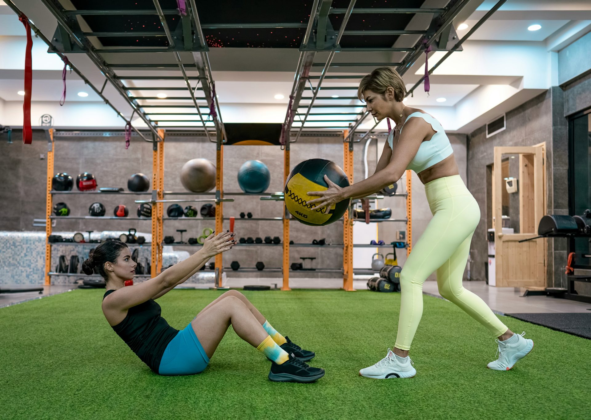 A couple of people that are playing with a ball